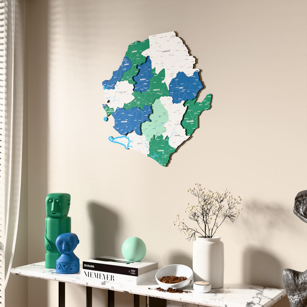 Flag colored Sierra Leone wooden wall map beside a sheer curtain, angled view