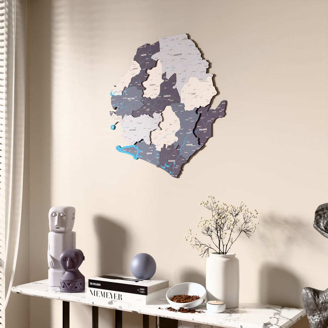 Nimbus Sierra Leone wooden wall map beside a sheer curtain, angled view
