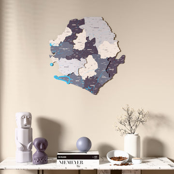 Nimbus Sierra Leone wooden wall map above a marble console, front view