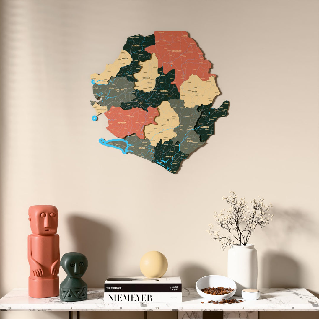 Sage Sierra Leone wooden wall map above a marble console, front view