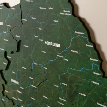 Close-up of the Satellite Sierra Leone wooden wall map with layered regions and printed names