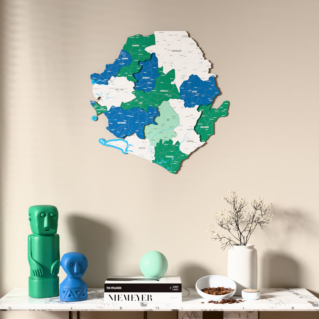 Flag colored Sierra Leone wooden wall map above a marble console, front view