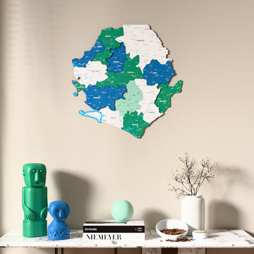Flag colored Sierra Leone wooden wall map above a marble console, front view