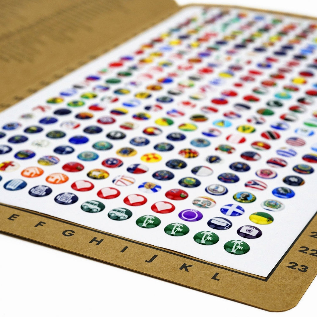 276-piece silicone pin sheet full of flag and activity icons, coordinate letters along the bottom edge