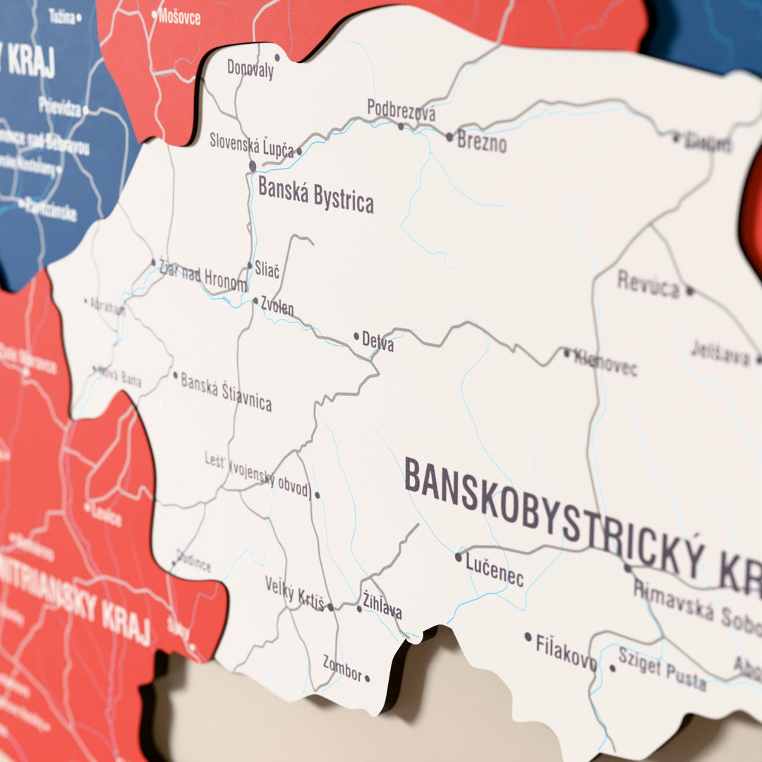 Close-up of the Flag colored Slovakia wooden wall map with layered regions and printed names