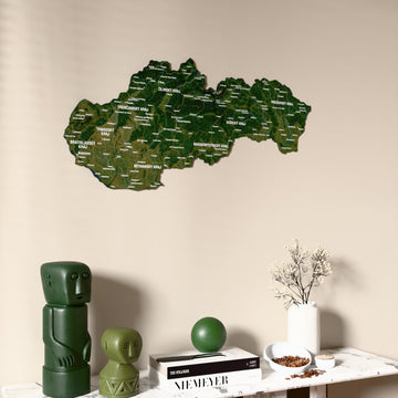 Satellite Slovakia wooden wall map on a beige wall above a console with figurines