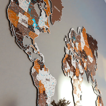 Side view of the Americas and Greenland on the Soil metal world map with USA and Brazil labels