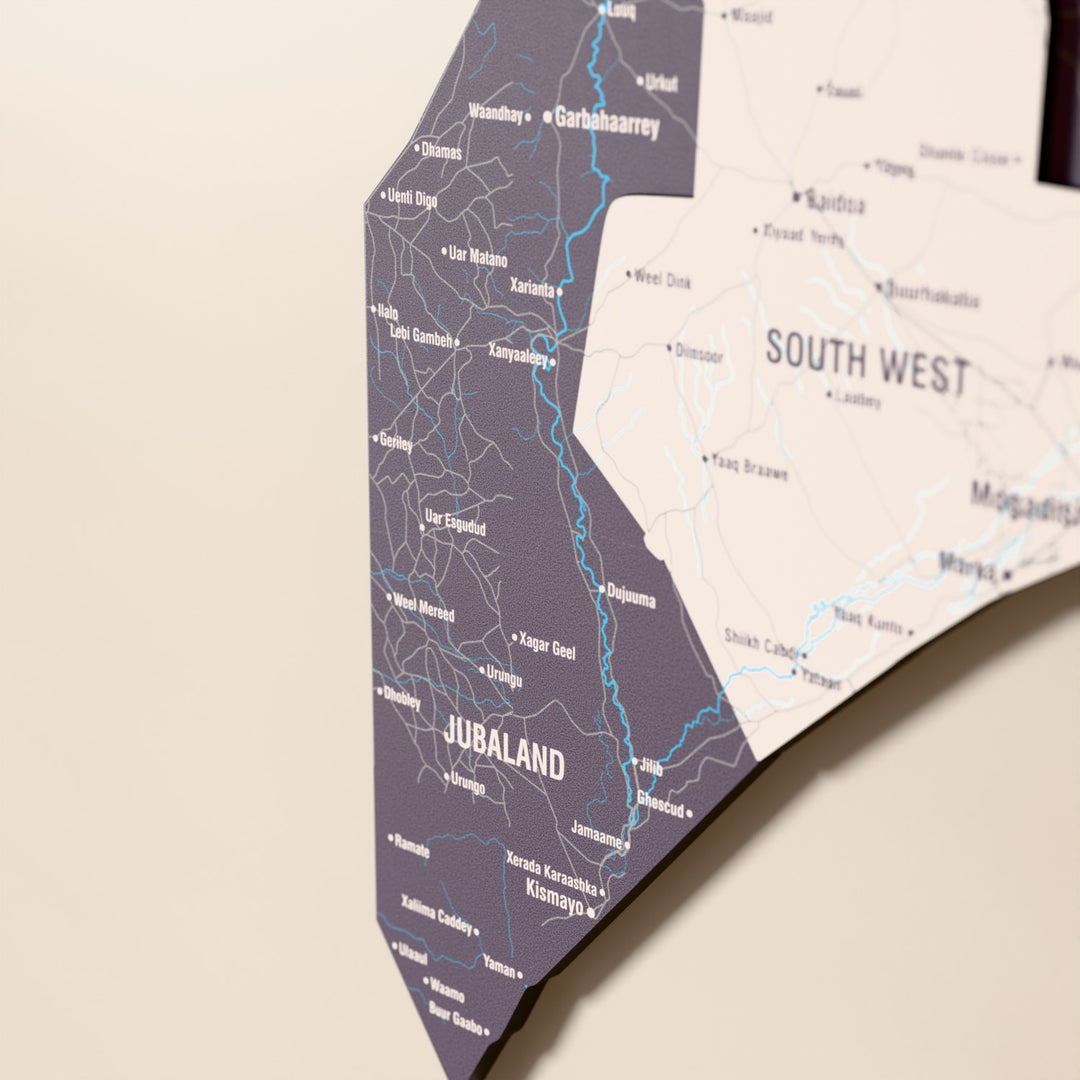 Close-up of the Nimbus Somalia wooden wall map with layered regions and printed names
