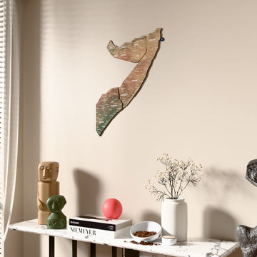 Satellite Somalia wooden wall map beside a sheer curtain, angled view
