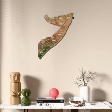 Satellite Somalia wooden wall map above a marble console, front view