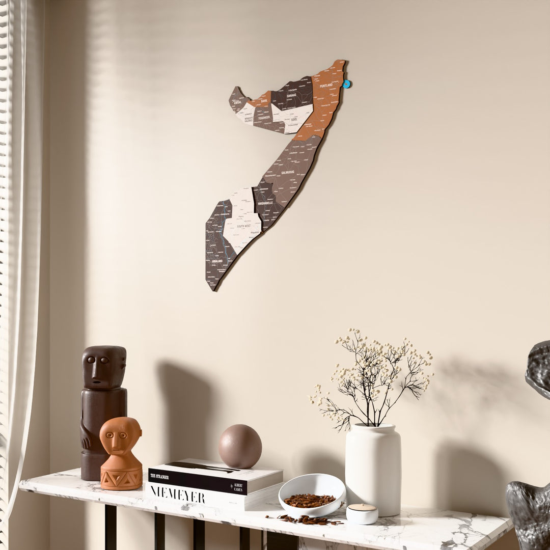 Soil Somalia wooden wall map beside a sheer curtain, angled view