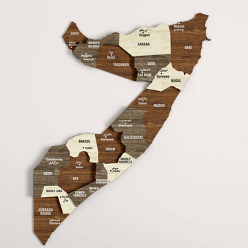Somalia wooden wall map with Arabic and English region names in brown, gray and cream layers, angled front view