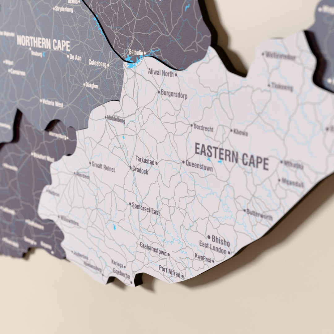 Close-up of the Nimbus South Africa wooden wall map with layered regions and printed names