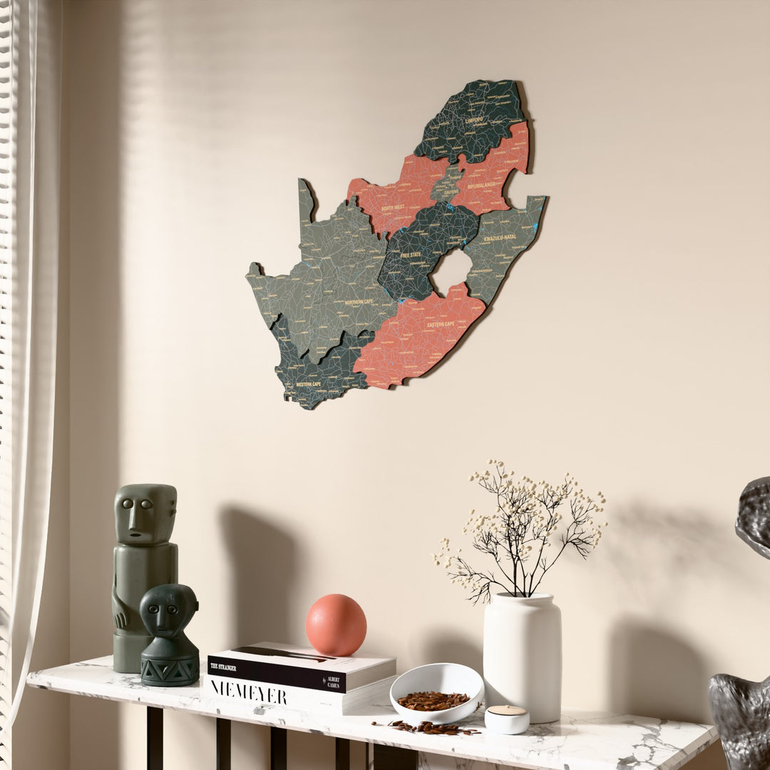 Sage South Africa wooden wall map beside a sheer curtain, angled view