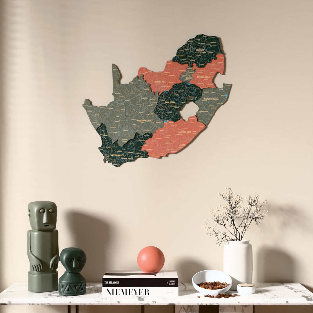 Sage South Africa wooden wall map above a marble console, front view