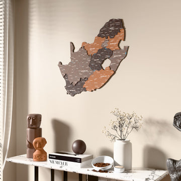 Soil South Africa wooden wall map beside a sheer curtain, angled view