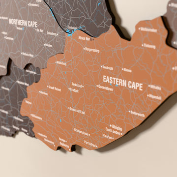 Close-up of the Soil South Africa wooden wall map with layered regions and printed names