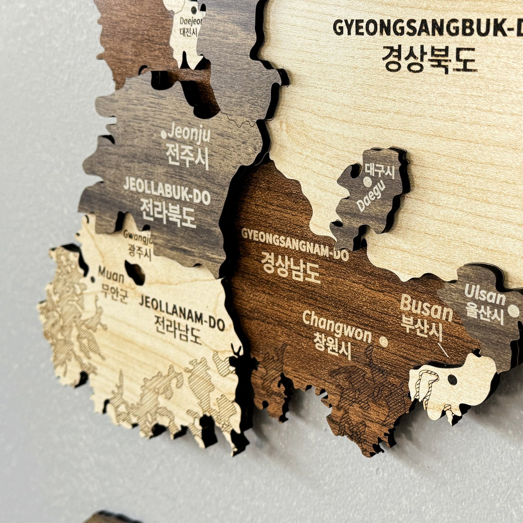 Close-up of the South Korea wooden wall map showing Jeonju, Busan and Gyeongsangnam-do labels in layered wood