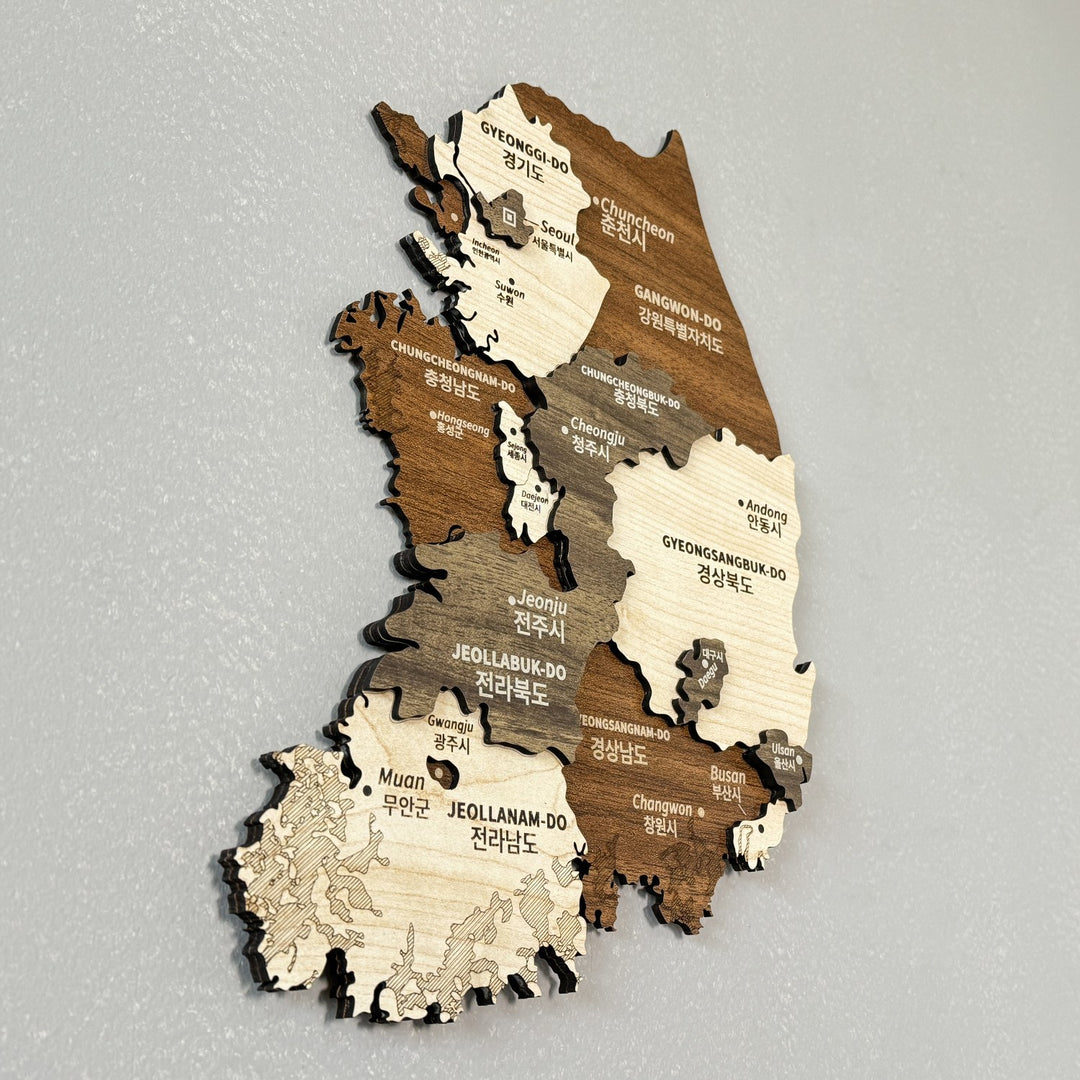South Korea wooden wall map seen from a low side angle, showing Korean labels and layered wood depth
