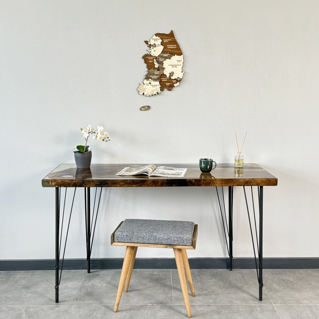 South Korea wooden wall map above a hairpin-leg desk with a gray stool, wide view