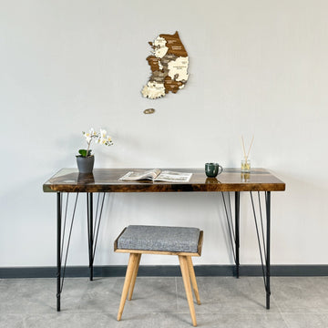 South Korea wooden wall map above a hairpin-leg desk with a gray stool, wide view