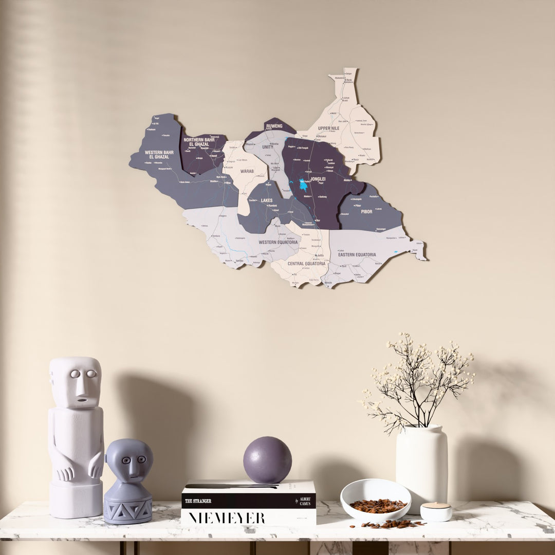 Nimbus South Sudan wooden wall map above a marble console, front view