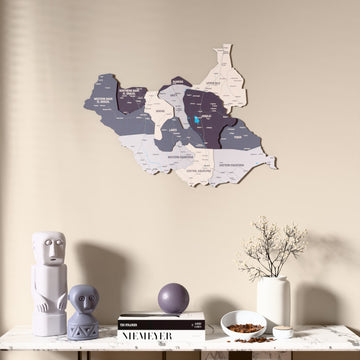 Nimbus South Sudan wooden wall map above a marble console, front view