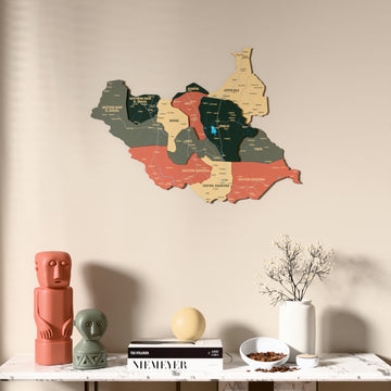 Sage South Sudan wooden wall map above a marble console, front view