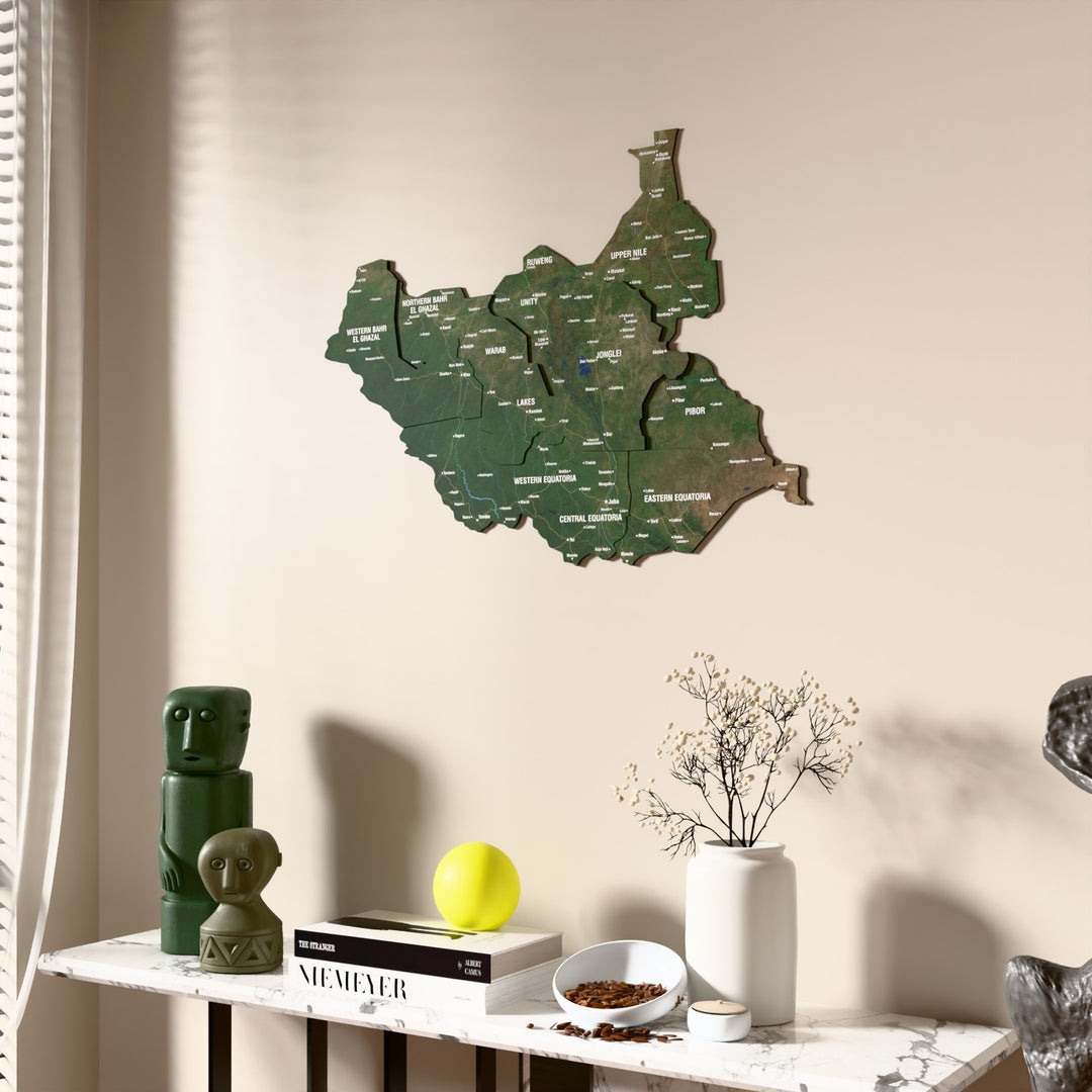 Satellite South Sudan wooden wall map beside a sheer curtain, angled view