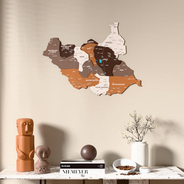 Soil South Sudan wooden wall map above a marble console, front view