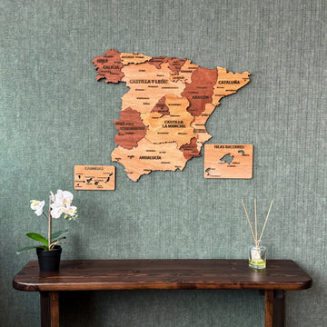 Wooden Spain wall map with region names and Canary and Balearic Islands panels, above a console
