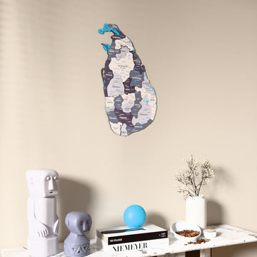 Nimbus Sri Lanka wooden wall map on a beige wall above a console with figurines