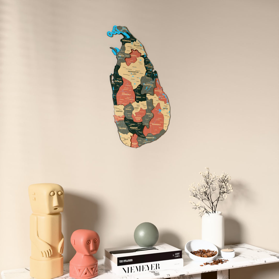 Sage Sri Lanka wooden wall map on a beige wall above a console with figurines