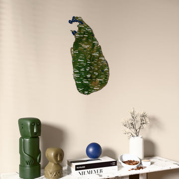 Satellite Sri Lanka wooden wall map on a beige wall above a console with figurines