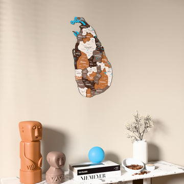 Soil Sri Lanka wooden wall map on a beige wall above a console with figurines