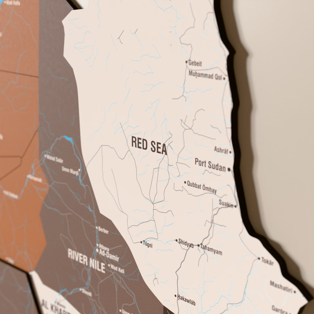 Close-up of the Soil Sudan wooden wall map with layered regions and printed names