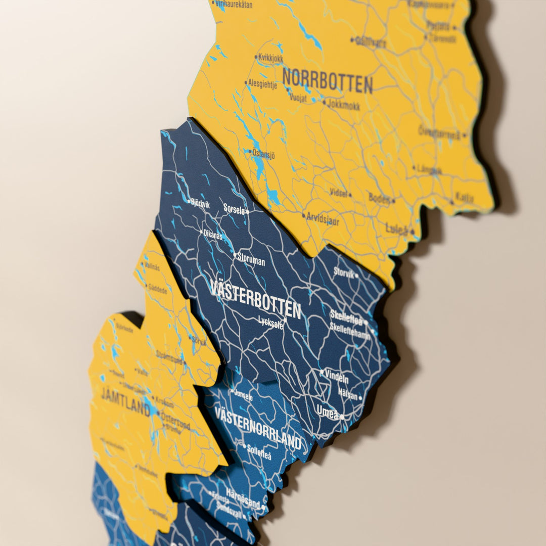 Close-up of the Flag colored Sweden wooden wall map with layered regions and printed names