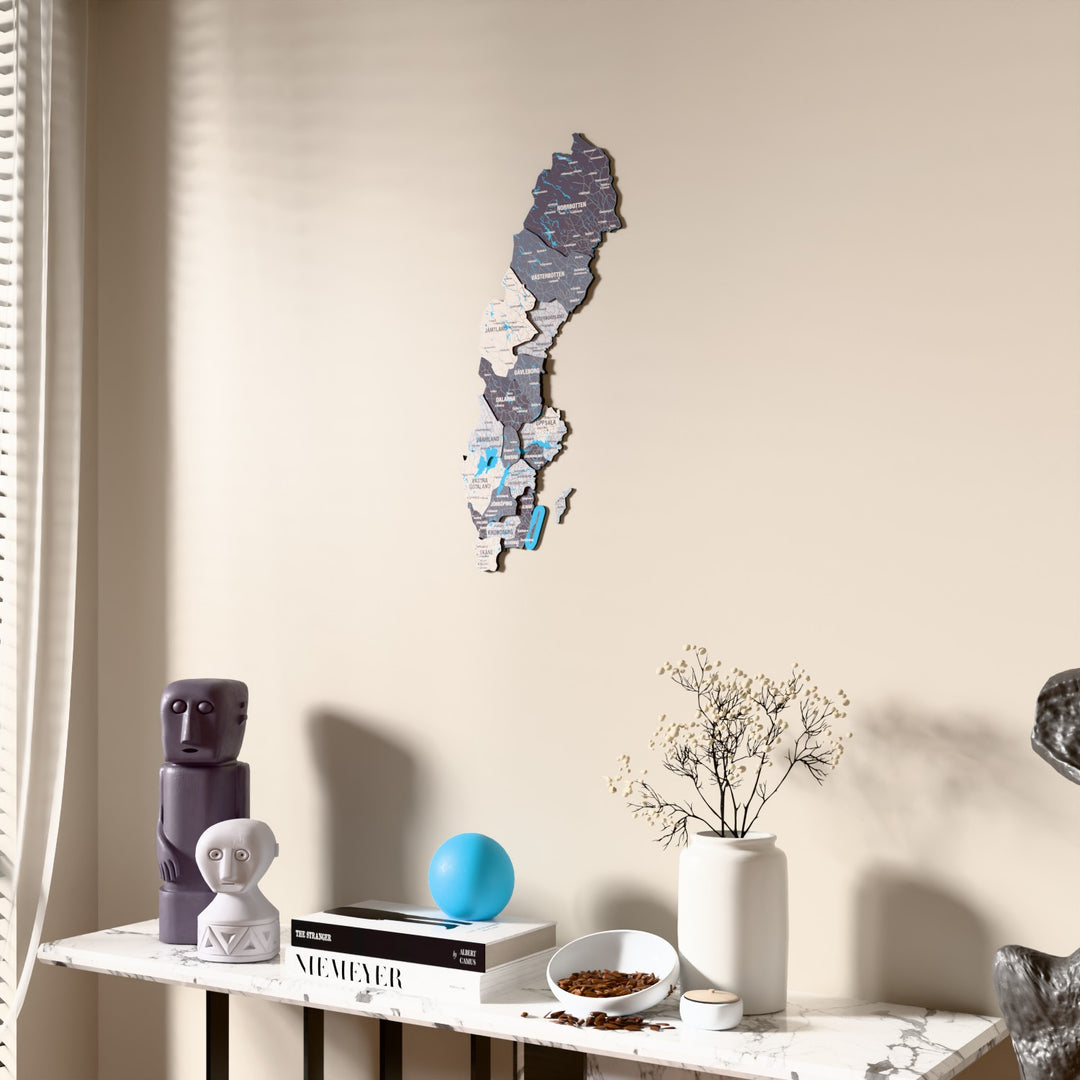 Nimbus Sweden wooden wall map beside a sheer curtain, angled view