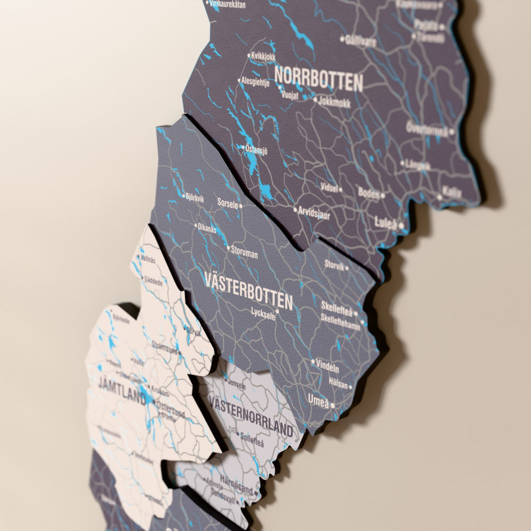 Close-up of the Nimbus Sweden wooden wall map with layered regions and printed names