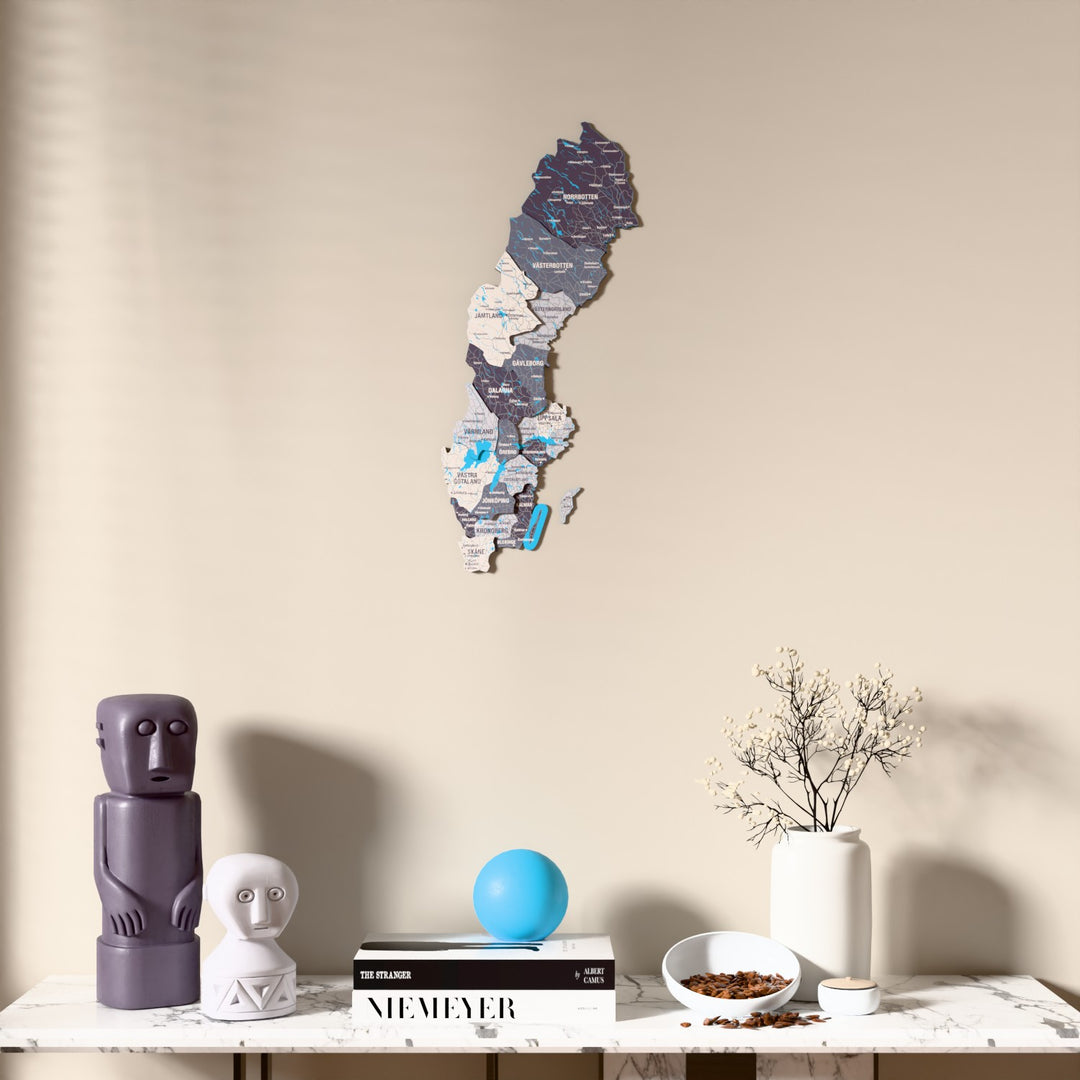 Nimbus Sweden wooden wall map above a marble console, front view
