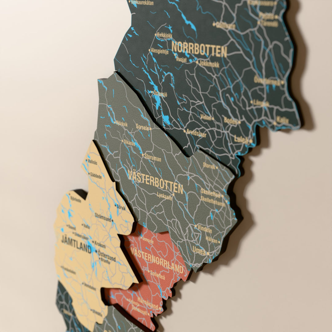 Close-up of the Sage Sweden wooden wall map with layered regions and printed names