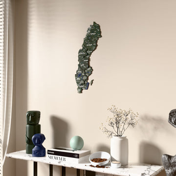 Satellite Sweden wooden wall map beside a sheer curtain, angled view
