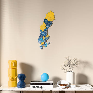 Flag colored Sweden wooden wall map above a marble console, front view