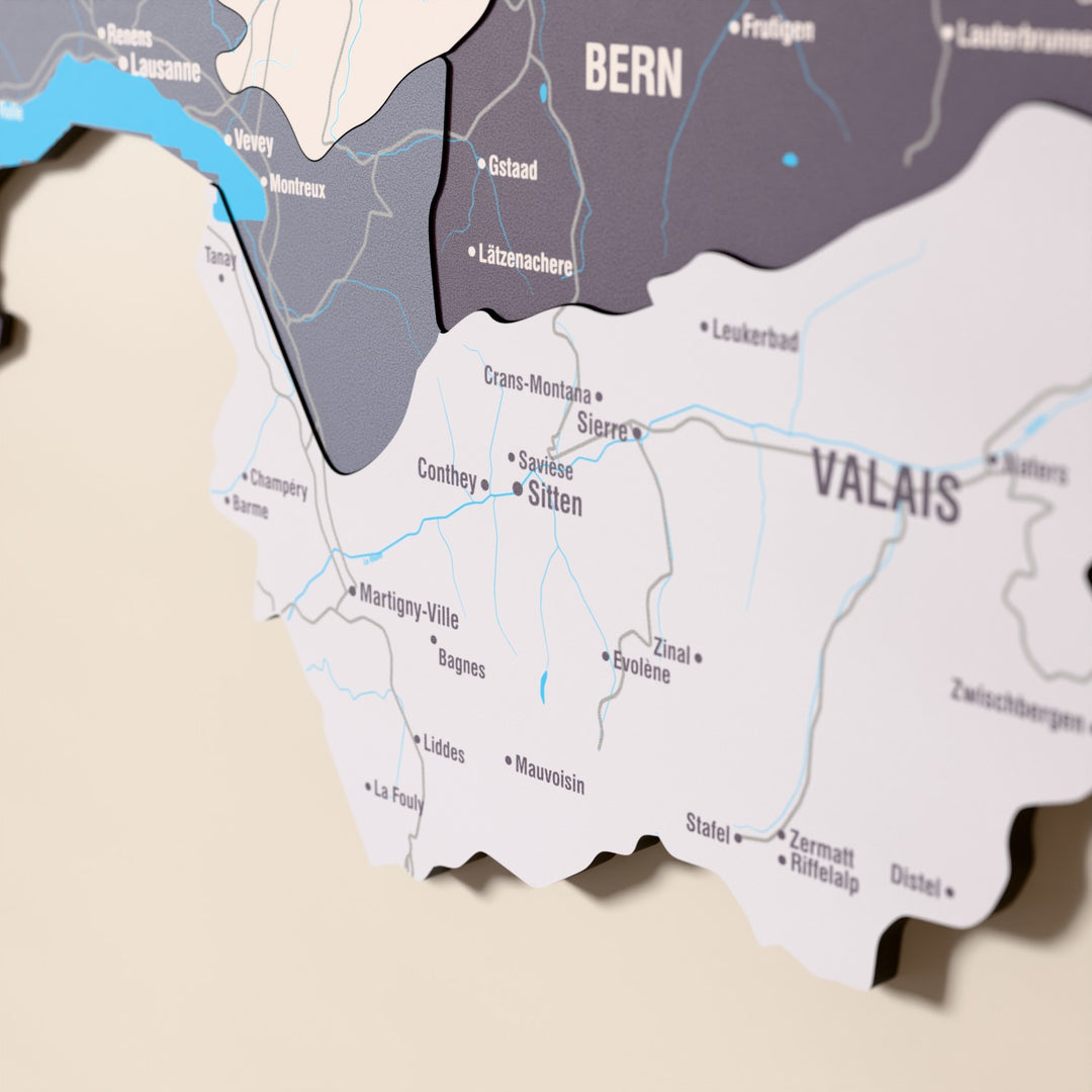 Close-up of the Nimbus Switzerland wooden wall map with layered regions and printed names
