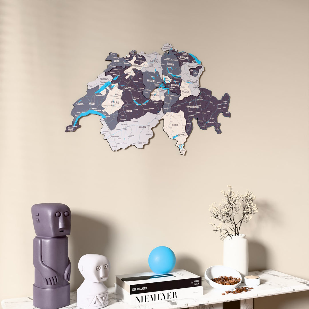 Nimbus Switzerland wooden wall map on a beige wall above a console with figurines