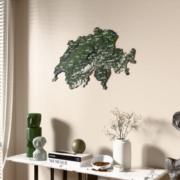 Satellite Switzerland wooden wall map beside a sheer curtain, angled view