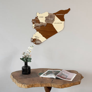 Syria wooden wall map in layered brown and cream wood above a live-edge table, close view