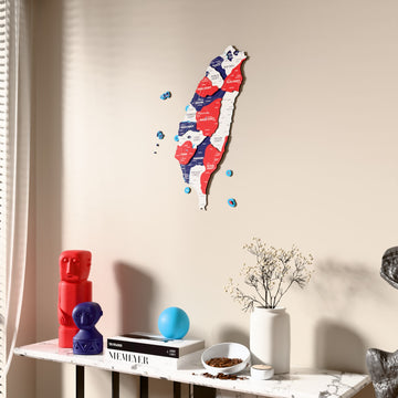 Flag colored Taiwan wooden wall map beside a sheer curtain, angled view