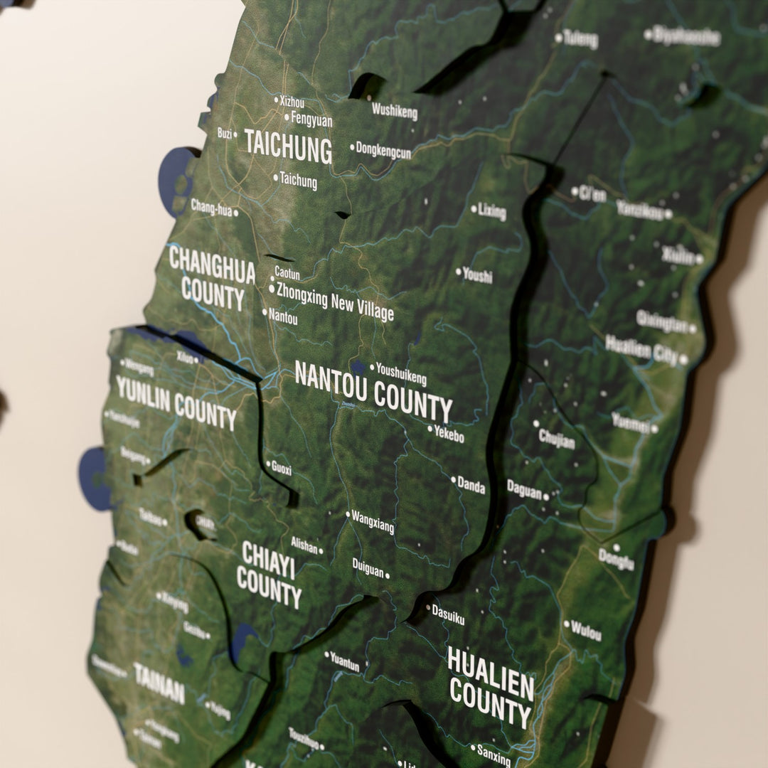 Close-up of the Satellite Taiwan wooden wall map with layered regions and printed names