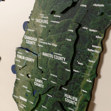 Close-up of the Satellite Taiwan wooden wall map with layered regions and printed names